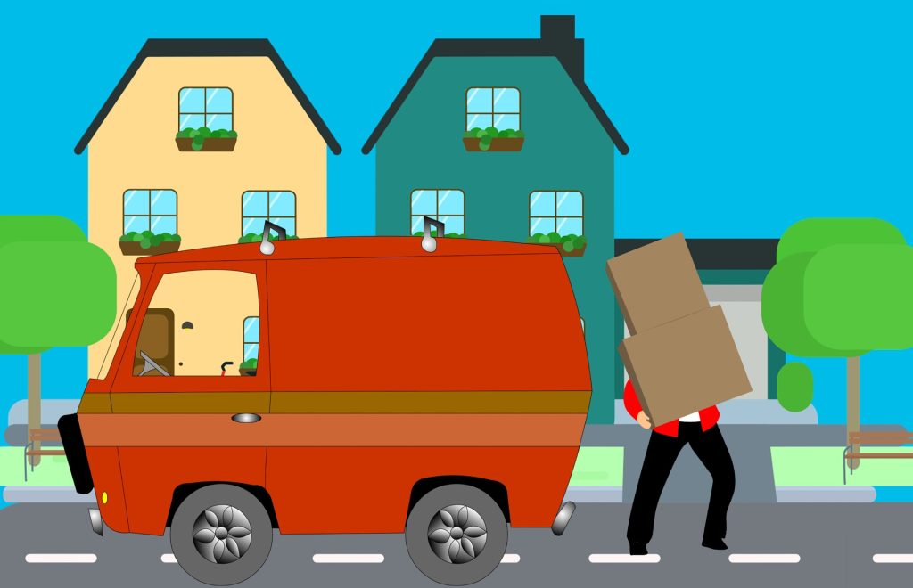 Man packing van with boxes to move house